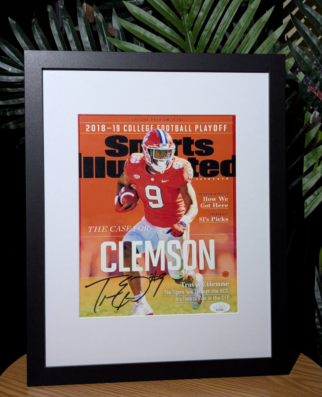 Signed Travis Etienne 8x10 (JSA)