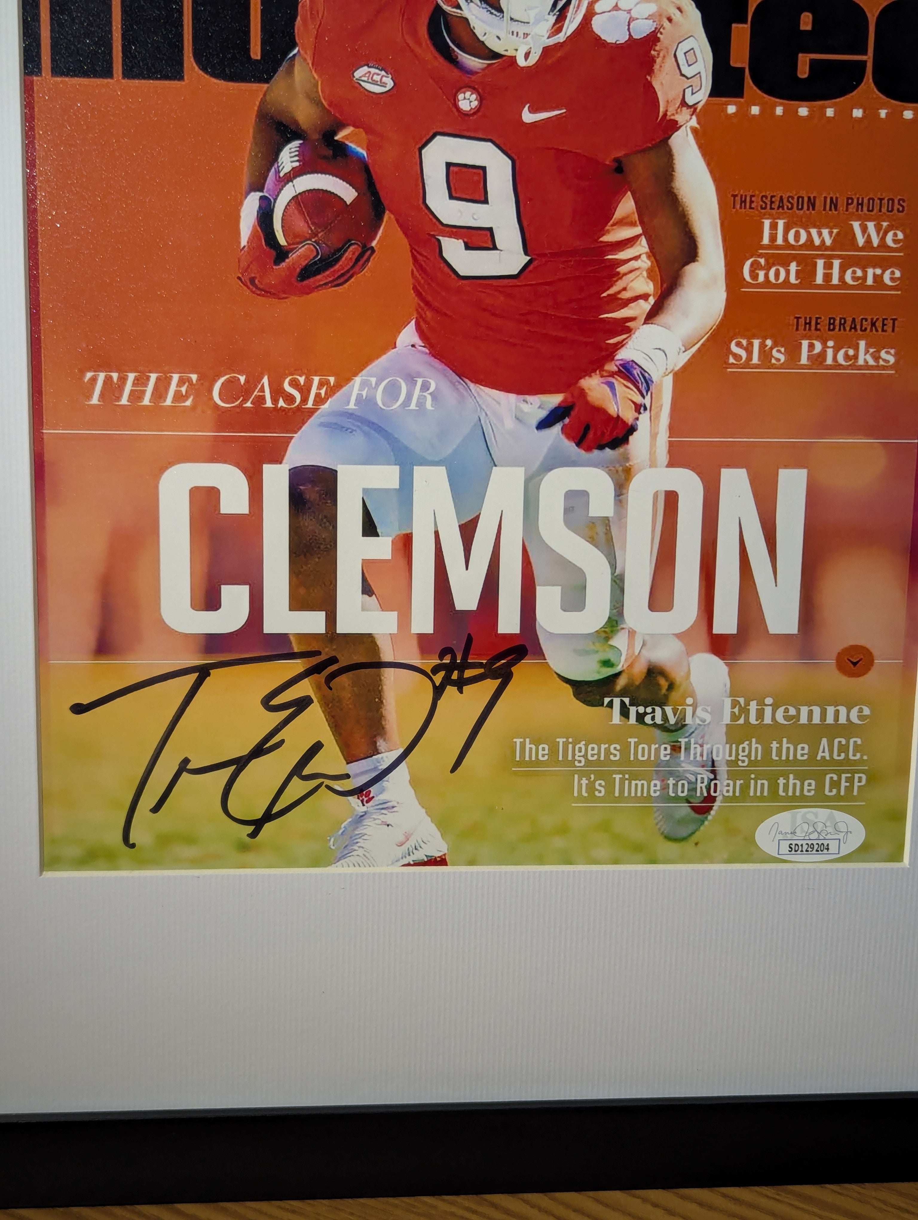 Signed Travis Etienne 8x10 (JSA)