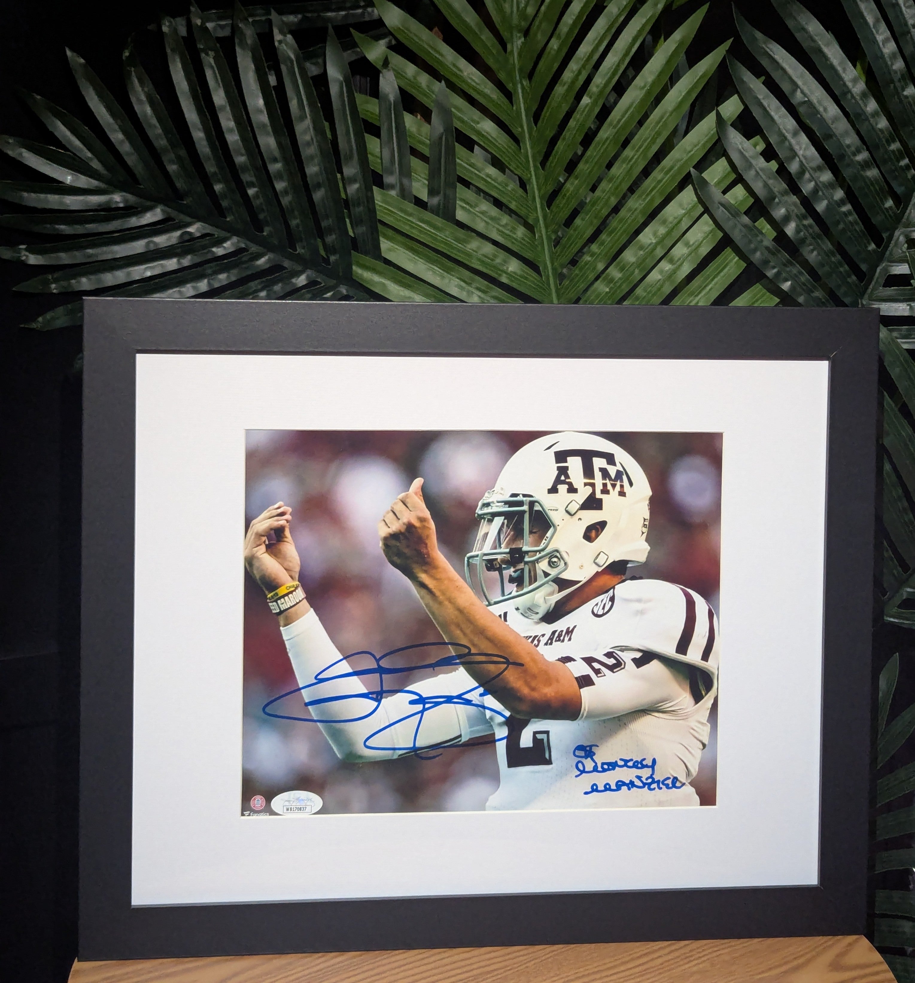 Signed Johnny Manziel "Money Manziel" 8x10 (JSA)